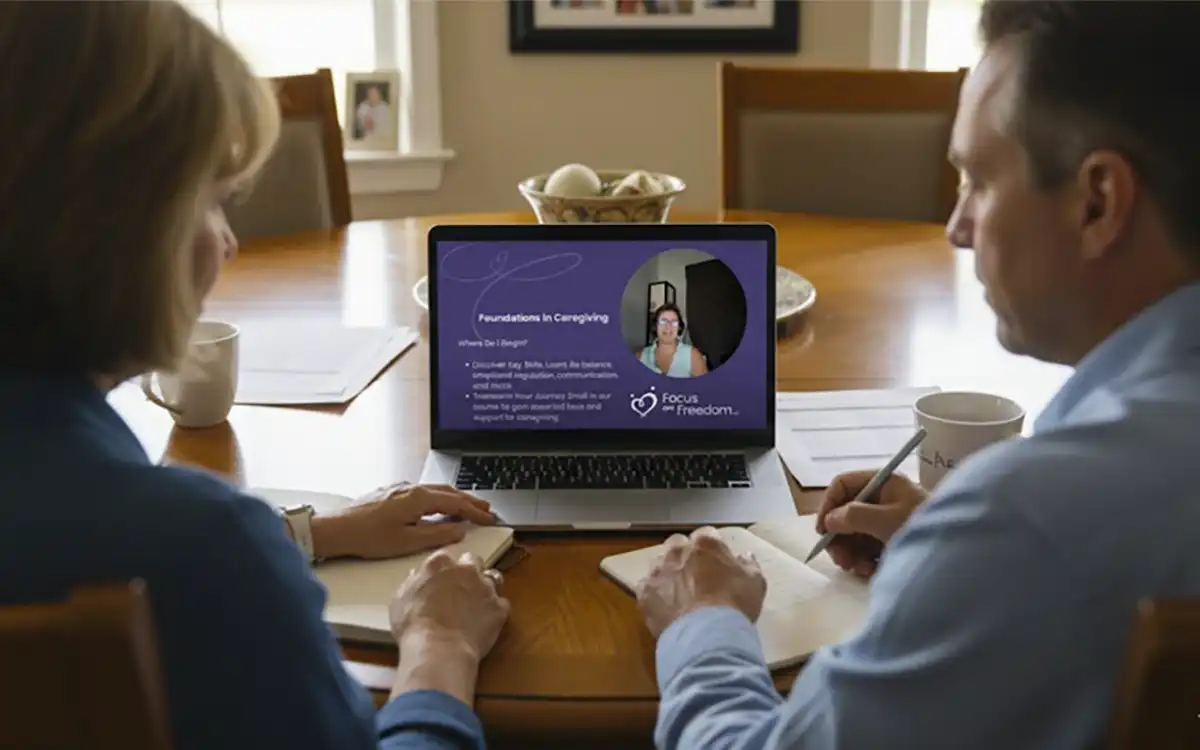 Man and a Woman Looking at Laptop Screen