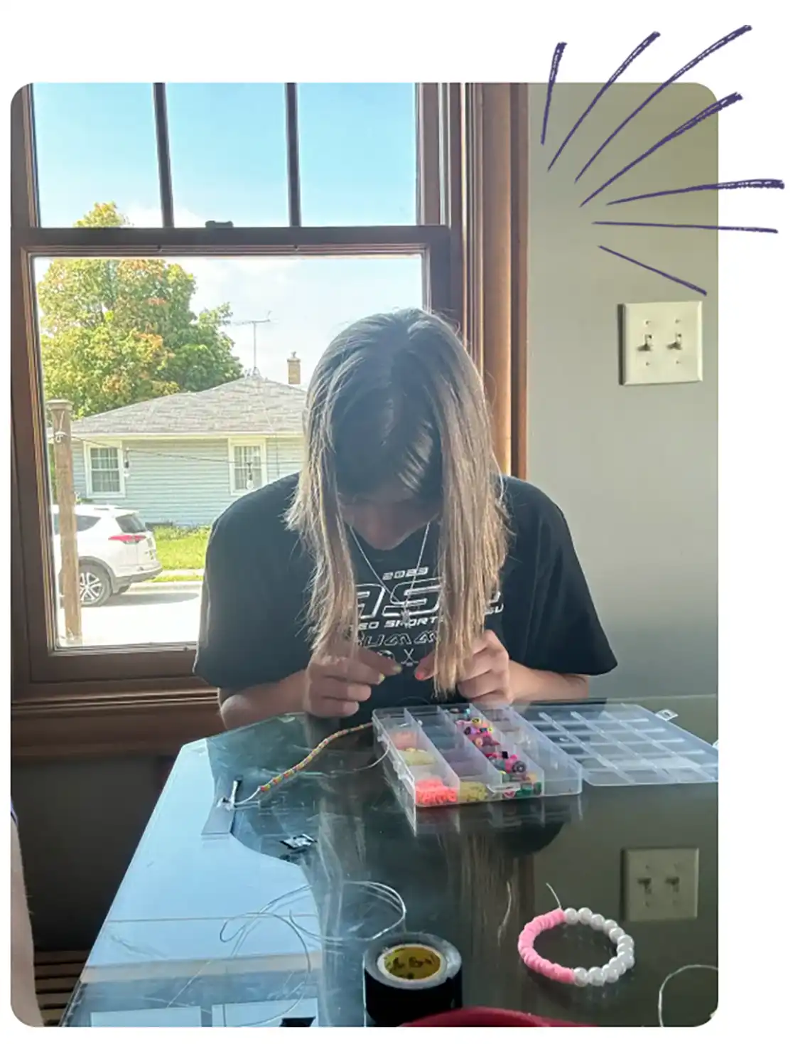 Child Sitting and Playing at The Desk