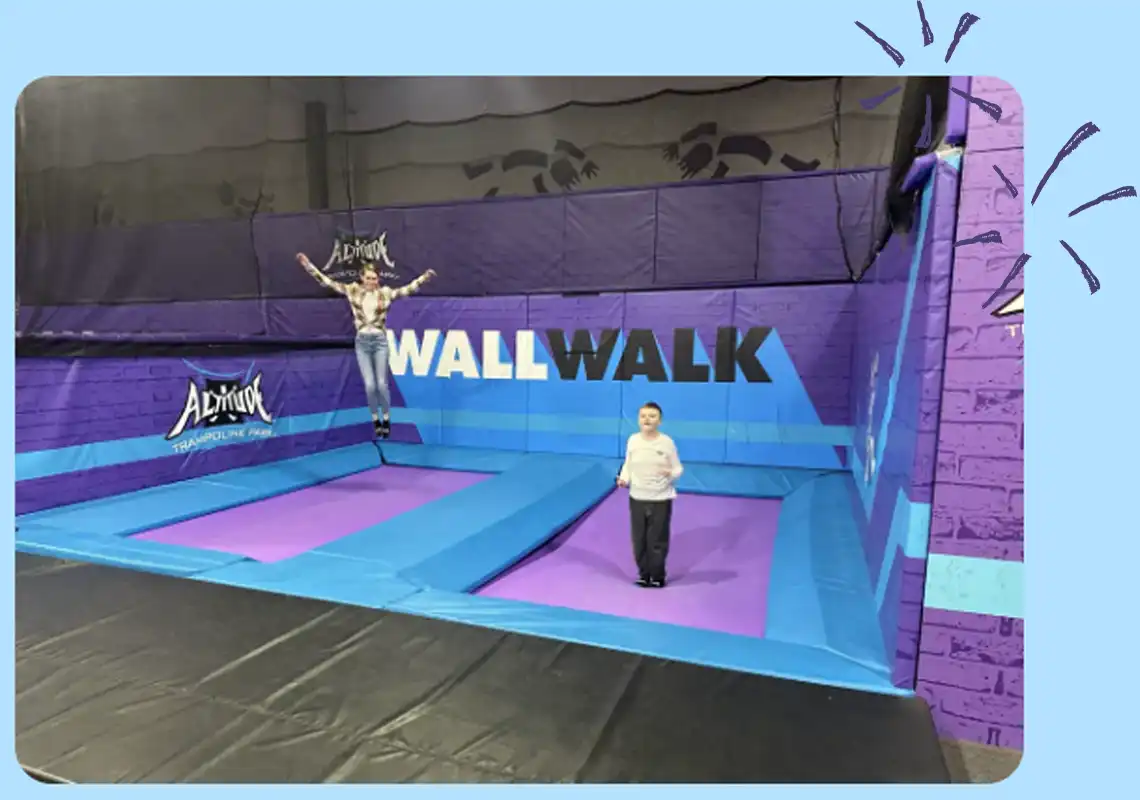Children Bouncing On Trampoline