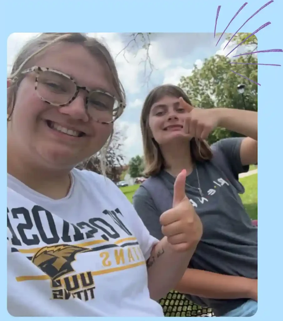 Two Girls Giving Thumbs Up